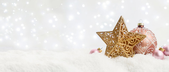 White christmas with snow - pink and golden decorations close up banner