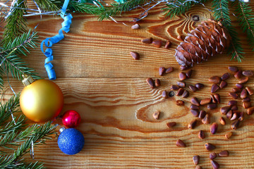 New Year, Christmas composition on wooden boards of cones and Christmas-tree decorations. taiga tale