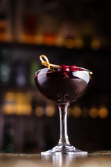 Alcoholic cocktail of cherry on the bar.