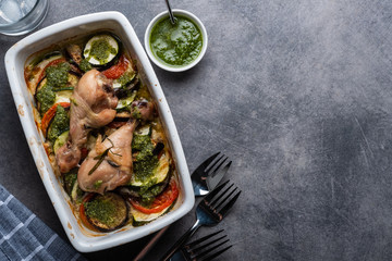 Ratatouille with chicken and pesto. French cuisine. Rosemary chicken with oven-roasted ratatouille.