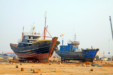 Fototapeta premium fishing boats waiting for repair