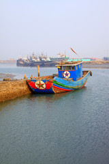 Naklejka na ściany i meble wooden fishing boat port wharf berthing