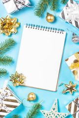 Christmas flatlay background - silver and gold decorations on bl