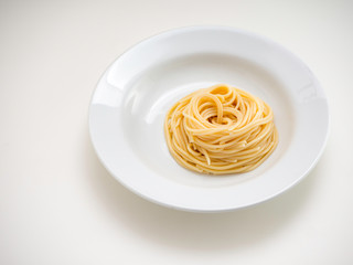 Obraz na płótnie Canvas spaghetti, pasta on plate on white background