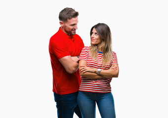 Young couple in love over isolated background happy face smiling with crossed arms looking at the camera. Positive person.