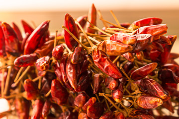 Fototapeta premium mini hot chili pods dried sun whole fruits a lot pile design design menu close-up background base of smoked paprika
