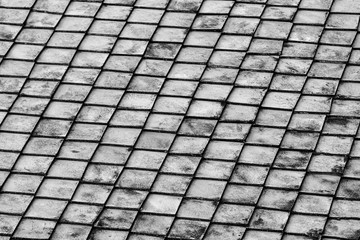 base row of gray stone tiles weathering corrosion repeating row background design