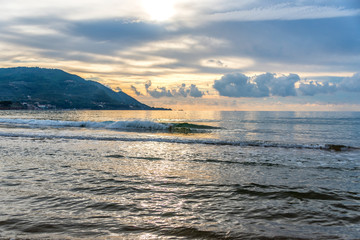Obraz premium Sunset Light Reflected on the Beach Along the Southern Mediterranean Italian Coast