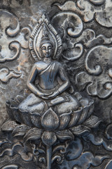 Thai style silver carving art on temple wall , Wat Srisuphan ,Chiang Mai, Thailand.