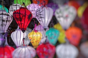 Fototapeta na wymiar Colorful lanterns spread light on the old street of Hoi An Ancient Town - UNESCO World Heritage Site. Vietnam.