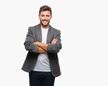 Young handsome business man over isolated background happy face smiling with crossed arms looking at the camera. Positive person.