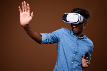 African man enjoying virtual reality while using VR glasses