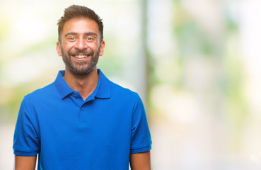 Fototapeta na wymiar Adult hispanic man over isolated background with a happy and cool smile on face. Lucky person.