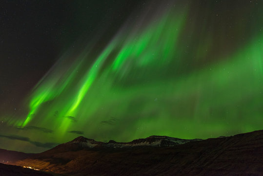 Aurora borealis Green on Teriberka in Murmansk region, Russia © mkitina4