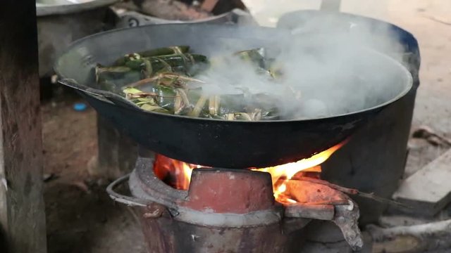 Glutinous rice steamed in banana leaf using firewood,Boiled using firewood,