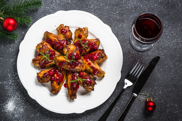 Baked chicken wings in cranberry sauce. 