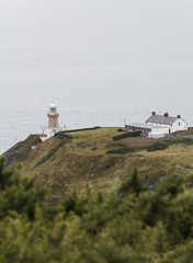 Fototapeta na wymiar A small lighthouse on the wild coast