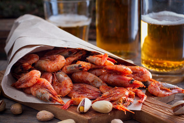 Shrimps for beer fried in tomato sauce, selective focus