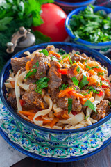 Laghman with beef and vegetables, selective focus