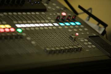 Music equipment closeup. Management console sound design at the event. Big black mixer with control knobs. Electronics and modern technology.
