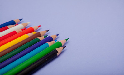Color Pencils on violet Background for Projects and Announcements