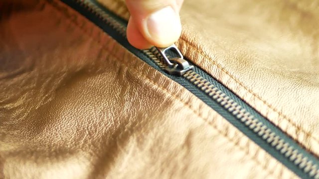 Elegant golden brown man's leather jacket with zipper