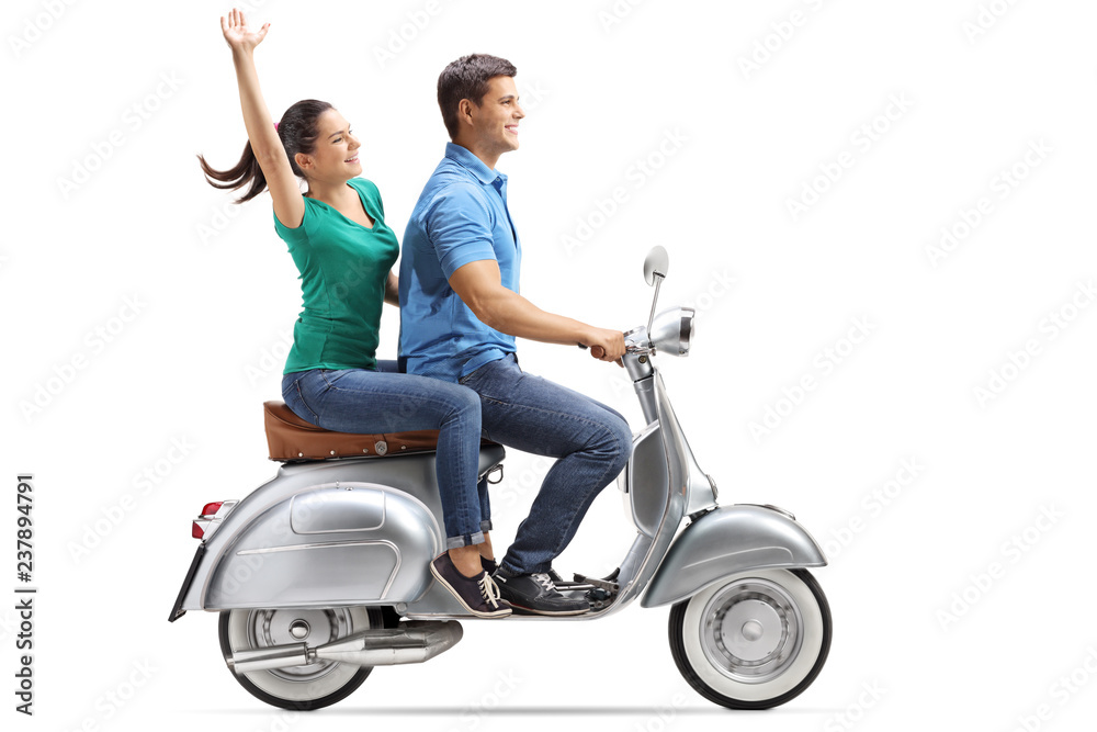 Sticker Young couple riding on a vintage motorbike and waving