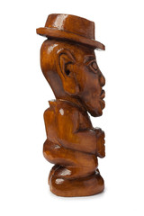 Fototapeta na wymiar A fabulous, exotic, unnatural wooden figure of a man in a hat. Isolated on white background.