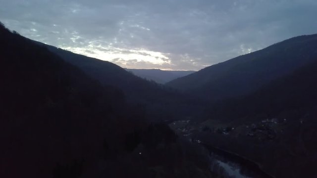 Transylvania, Romania. An aerial ascent on a moody, overcast day, showing off the spectacular Cluj-Napoca valley