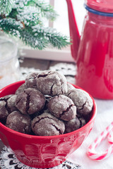 Homemade chocolate cookies with cracks. Biscuits with icing sugar. Selective focus