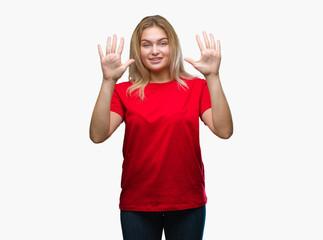 Fototapeta na wymiar Young caucasian woman over isolated background showing and pointing up with fingers number ten while smiling confident and happy.