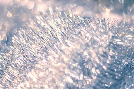 Shiny tinsel background. Silver Christmas background. Abstract Winter bokeh.