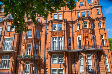 Fototapeta na wymiar London, UK. Residential area of Kensington and Chelsea. Row of periodic buildings. 
