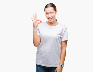 Young beautiful caucasian woman over isolated background smiling positive doing ok sign with hand and fingers. Successful expression.