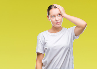 Young beautiful caucasian woman over isolated background confuse and wonder about question. Uncertain with doubt, thinking with hand on head. Pensive concept.