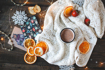 dried orange slices, christmas decor. white plaid with a garland. close-up