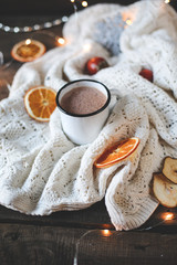 dried orange slices, christmas decor. white plaid with a garland. close-up