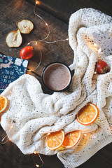 dried orange slices, christmas decor. white plaid with a garland. close-up