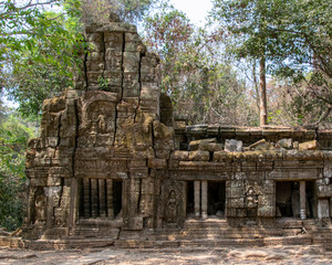 The temple is partially recovered from the jungle. Many ruins have been reconstructed some remain a jumble of stone with trees growing through the site