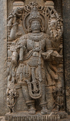 Fototapeta na wymiar Artistic stone sculptures of Hindu Gods and Goddesses at Somanathapura Temple, Karnataka, India
