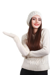 Smiling teenage girl wearing winter hat and gloves. Isolated