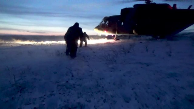 People go to the helicopter