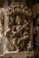 Artistic stone sculptures and carvings of Hindu Gods and Goddesses at Somanathapura Temple in Karnataka, India. 