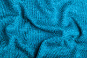 Plakat Blue knitted fabric texture close up. Can be used as a background. Selective focus