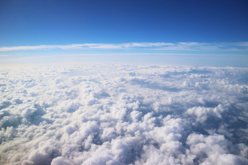 Naklejka na ściany i meble The sea of ​​clouds that goes on forever / 飛行機から見えるどこまでも続く雲海。