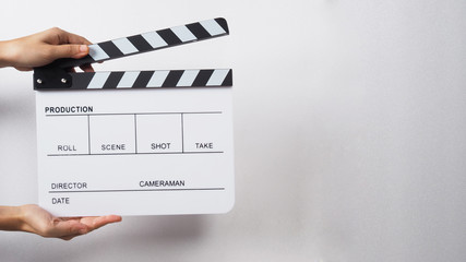 Two Hand's holding Clapperboard or clap board or movie slate use in video production ,film, cinema...