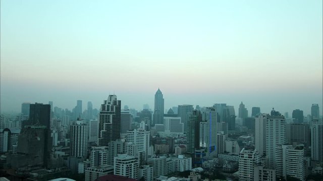 View footage Day to Night time lapse of Bangkok building city skyline at sunset 