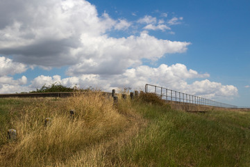 View along the sea wall on Canvey Island, Essex, England