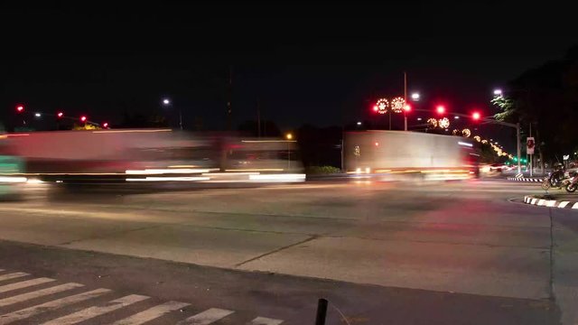 A Traffic time lapse shot at night in Manila, The Philippines. Shot by using an intervalometer and a long exposure time to get this beautiful motion blur  from the moving vehicles and their lights.