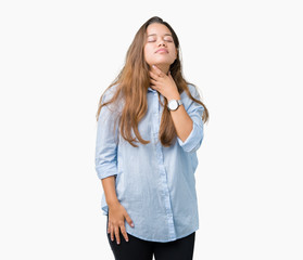 Fototapeta premium Young beautiful brunette business woman over isolated background Touching painful neck, sore throat for flu, clod and infection